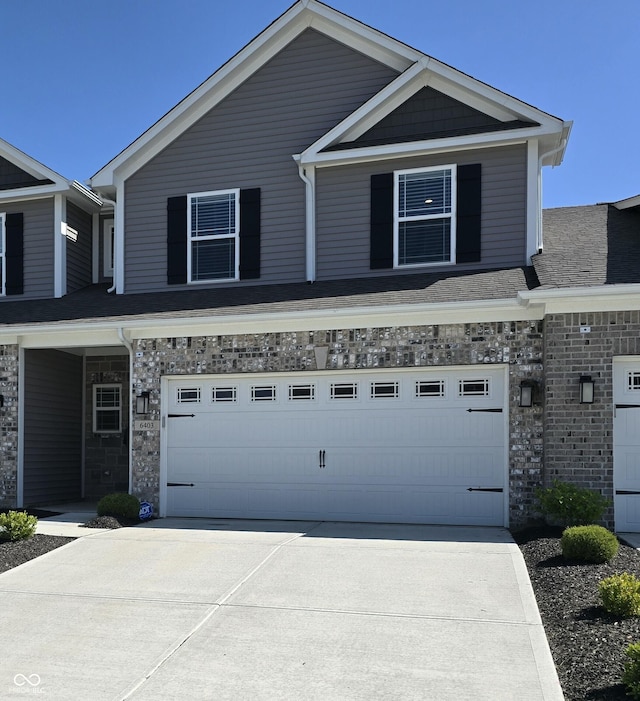 6403 Yuma Ct, Whitestown, IN 46075 - view of front of house featuring a garage, driveway, and stone siding