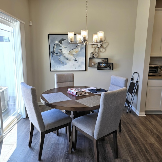 6403 Yuma Ct, Whitestown, IN 46075 - dining area featuring a chandelier, dark wood-style floors, and plenty of natural light