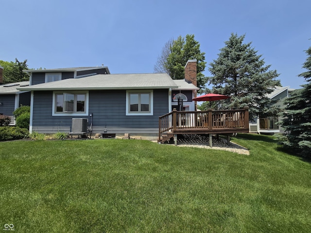 8055 Foxchase Dr, Indianapolis, IN 46256 - back of house featuring a deck, a chimney, and a lawn