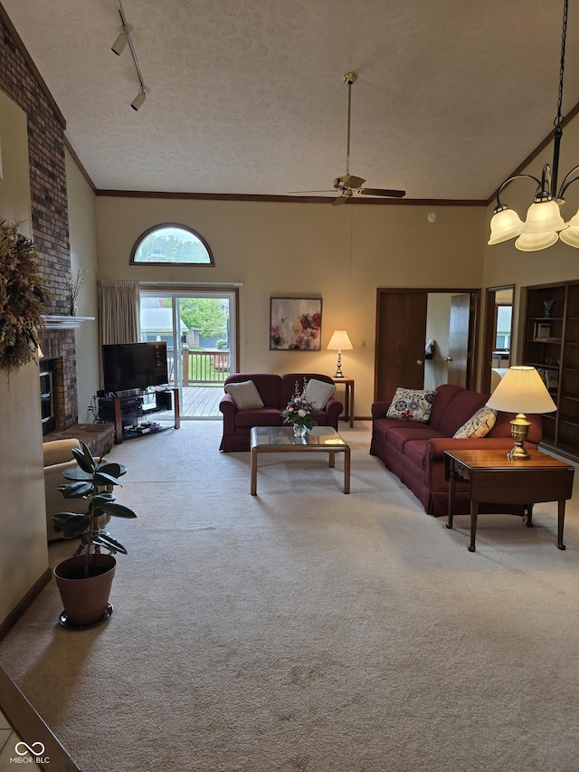 8055 Foxchase Dr, Indianapolis, IN 46256 - living area with carpet floors, ornamental molding, rail lighting, ceiling fan, and a textured ceiling