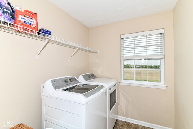 9860 Gallop Ln, Fishers, IN 46040 - laundry room featuring washer and dryer and baseboards