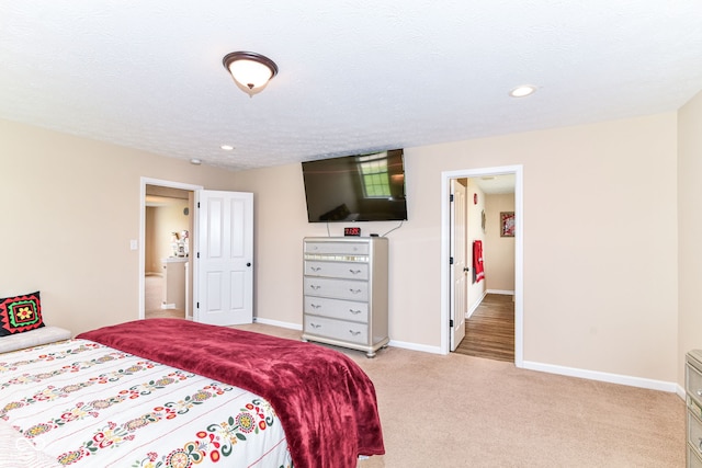 9860 Gallop Ln, Fishers, IN 46040 - bedroom with light colored carpet, recessed lighting, and a textured ceiling