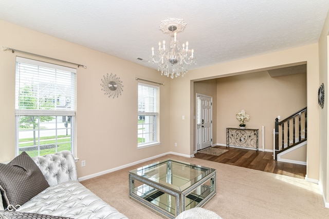 9860 Gallop Ln, Fishers, IN 46040 - living area featuring a chandelier, carpet floors, and stairs