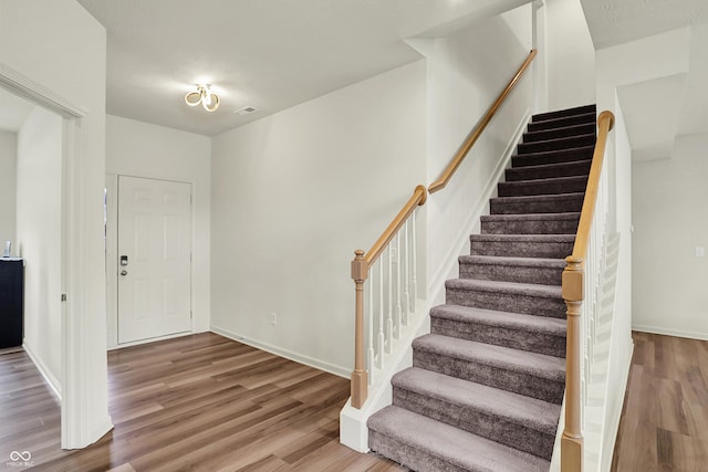 5366 Laurel Crest Run, Noblesville, IN 46062 - foyer entrance featuring wood finished floors, stairway, and baseboards
