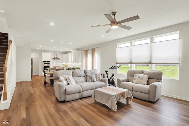 5366 Laurel Crest Run, Noblesville, IN 46062 - living area featuring ceiling fan, light wood-style floors, recessed lighting, stairs, and baseboards