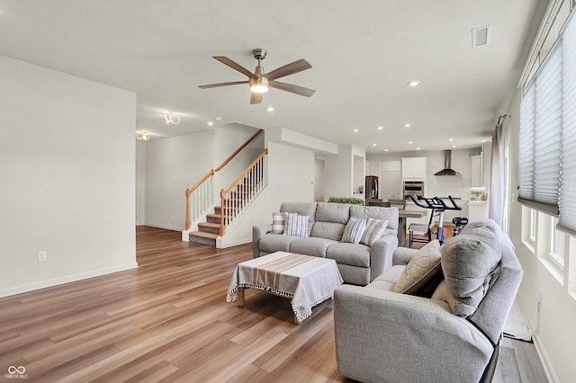 5366 Laurel Crest Run, Noblesville, IN 46062 - living area featuring light wood-style floors, ceiling fan, stairway, healthy amount of natural light, and recessed lighting