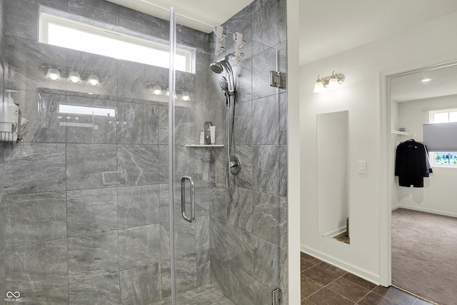 5366 Laurel Crest Run, Noblesville, IN 46062 - bathroom featuring a stall shower, baseboards, and tile patterned floors