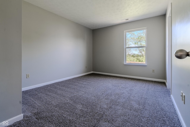 6491 Enclave Blvd, Greenwood, IN 46143 - carpeted spare room featuring a textured ceiling and baseboards