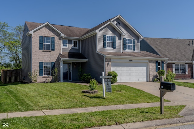 6491 Enclave Blvd, Greenwood, IN 46143 - view of front of property featuring driveway and brick siding