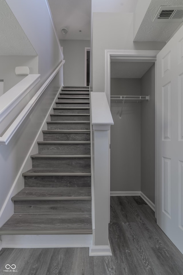 6491 Enclave Blvd, Greenwood, IN 46143 - staircase featuring wood finished floors and baseboards