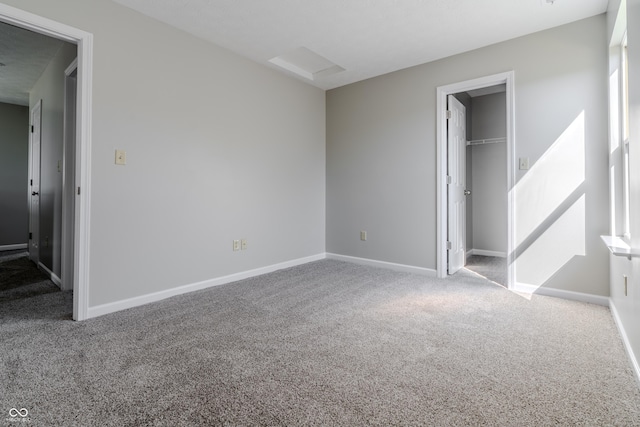 6491 Enclave Blvd, Greenwood, IN 46143 - unfurnished bedroom featuring carpet floors, baseboards, and a spacious closet