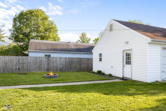 2336 Sycamore St, Columbus, IN 47201 - view of yard with an outdoor fire pit and an outdoor structure