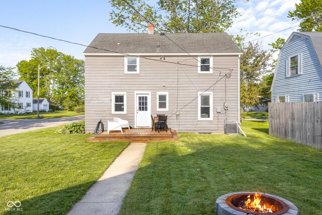 2336 Sycamore St, Columbus, IN 47201 - rear view of house featuring a wooden deck, central air condition unit, an outdoor fire pit, a chimney, and roof with shingles