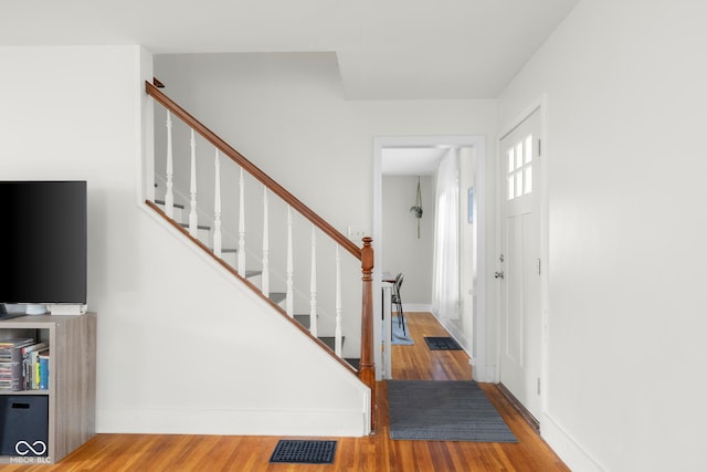 2336 Sycamore St, Columbus, IN 47201 - foyer with wood finished floors, stairway, and baseboards
