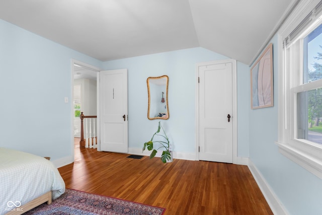 2336 Sycamore St, Columbus, IN 47201 - unfurnished bedroom featuring wood finished floors, baseboards, and vaulted ceiling
