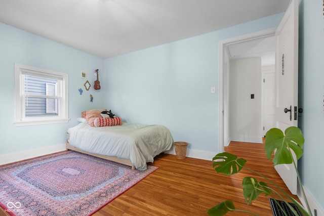 2336 Sycamore St, Columbus, IN 47201 - bedroom featuring attic access, wood finished floors, and baseboards