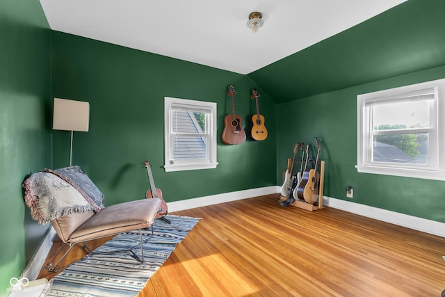 2336 Sycamore St, Columbus, IN 47201 - sitting room featuring lofted ceiling, wood finished floors, and baseboards
