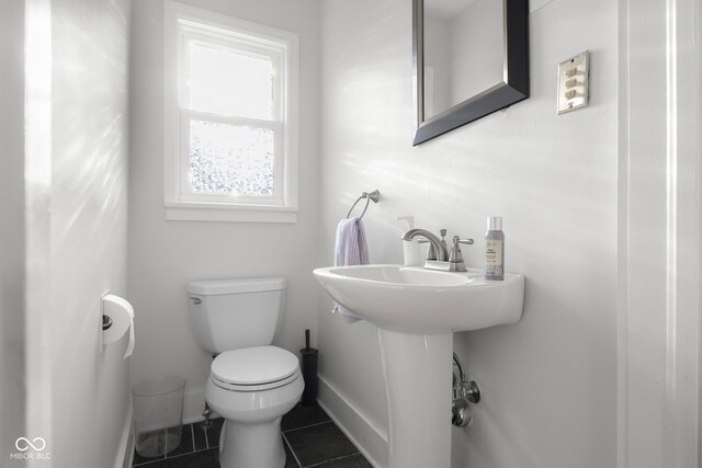 2336 Sycamore St, Columbus, IN 47201 - bathroom with toilet, baseboards, and tile patterned floors