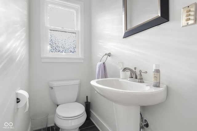 2336 Sycamore St, Columbus, IN 47201 - half bathroom featuring toilet and tile patterned flooring