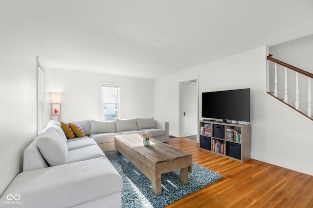 2336 Sycamore St, Columbus, IN 47201 - living room with wood finished floors, stairway, and baseboards