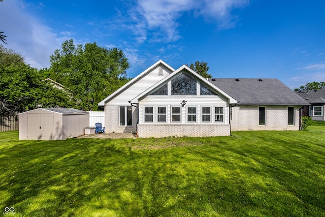 51 Glasgow Ln, Noblesville, IN 46060 - back of house with brick siding, a storage shed, an outbuilding, and a patio