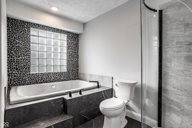 51 Glasgow Ln, Noblesville, IN 46060 - bathroom with toilet, a textured ceiling, a bath, and a shower