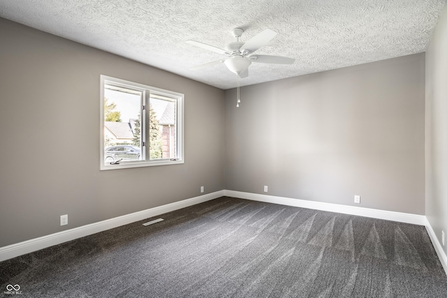51 Glasgow Ln, Noblesville, IN 46060 - empty room with ceiling fan, baseboards, dark carpet, and a textured ceiling
