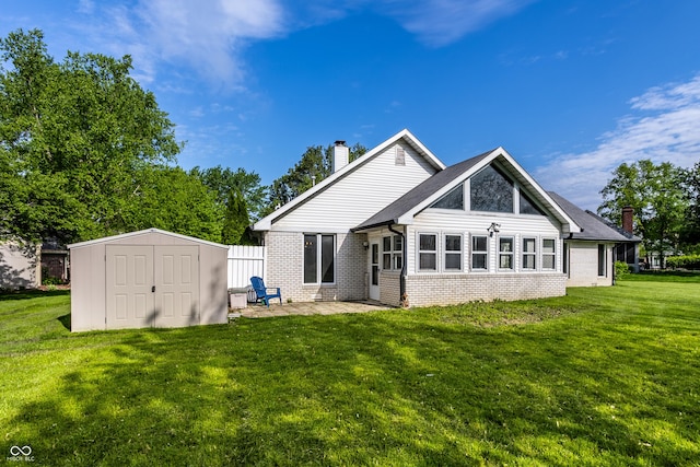 51 Glasgow Ln, Noblesville, IN 46060 - rear view of property with brick siding, a chimney, a storage shed, a patio, and a yard