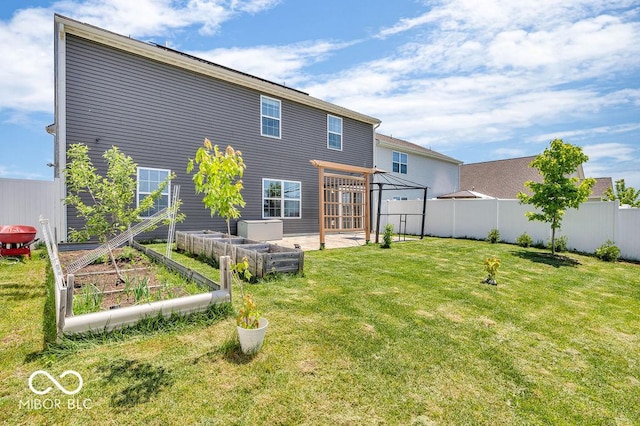 5256 Bramwell Ln, Whitestown, IN 46075 - back of property featuring a vegetable garden and a patio
