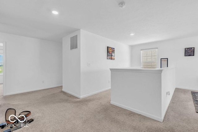 5256 Bramwell Ln, Whitestown, IN 46075 - spare room featuring a smoke detector, carpet flooring, baseboards, and recessed lighting