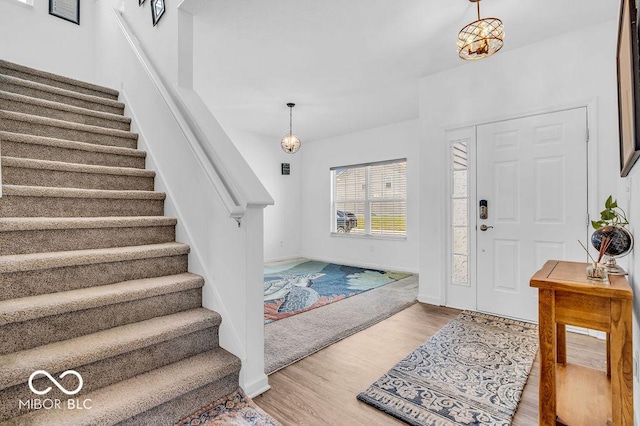5256 Bramwell Ln, Whitestown, IN 46075 - foyer entrance featuring stairs, wood finished floors, and baseboards