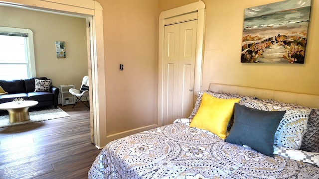 1148 N Pershing Ave, Indianapolis, IN 46222 - bedroom featuring dark wood-style floors, a closet, and baseboards
