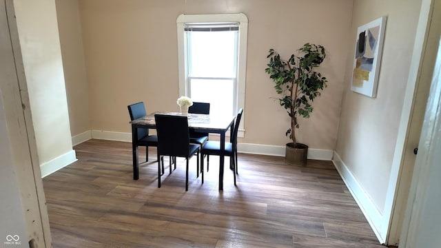 1148 N Pershing Ave, Indianapolis, IN 46222 - dining area featuring baseboards and dark wood-type flooring