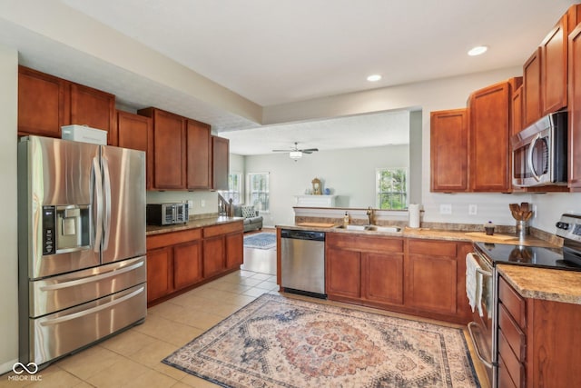 13063 E 131st St, Fishers, IN 46037 - kitchen with stainless steel appliances, a sink, recessed lighting, ceiling fan, and light tile patterned floors