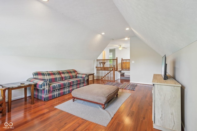13063 E 131st St, Fishers, IN 46037 - living area with vaulted ceiling, wood finished floors, ceiling fan, and baseboards