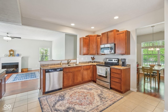 13063 E 131st St, Fishers, IN 46037 - kitchen featuring appliances with stainless steel finishes, a sink, a chandelier, light tile patterned floors, and recessed lighting