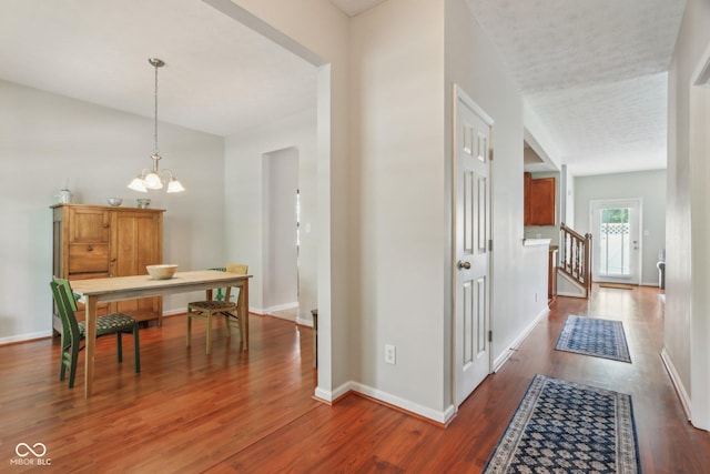 13063 E 131st St, Fishers, IN 46037 - corridor featuring wood finished floors, a chandelier, baseboards, and stairs