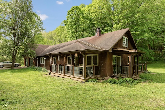 7730 Bear Creek Rd, Morgantown, IN 46160 - rear view of house with a chimney, a lawn, and a porch