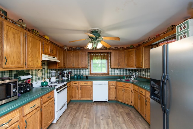 7730 Bear Creek Rd, Morgantown, IN 46160 - kitchen featuring appliances with stainless steel finishes, a sink, a ceiling fan, and decorative backsplash