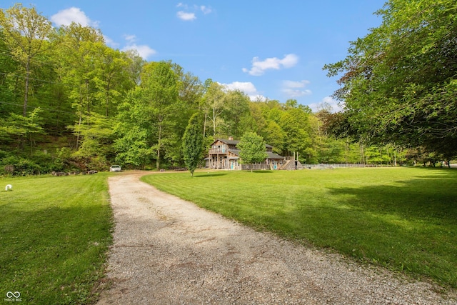 7730 Bear Creek Rd, Morgantown, IN 46160 - view of home's community featuring a wooded view, a lawn, and driveway