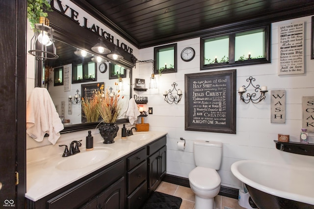 7730 Bear Creek Rd, Morgantown, IN 46160 - bathroom with double vanity, a soaking tub, tile patterned flooring, and toilet