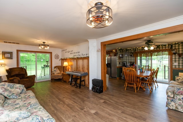 7730 Bear Creek Rd, Morgantown, IN 46160 - living area with a chandelier, wood finished floors, ornamental molding, and ceiling fan