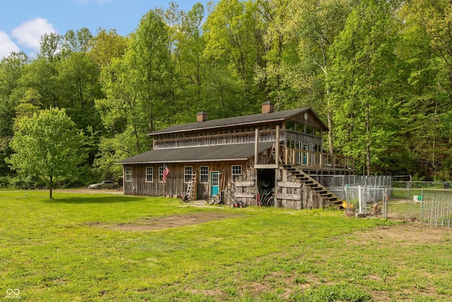 7730 Bear Creek Rd, Morgantown, IN 46160 - rear view of property with stairs, a chimney, a wooden deck, and a forest view