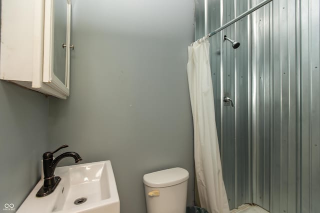 7730 Bear Creek Rd, Morgantown, IN 46160 - bathroom featuring a sink, toilet, and a shower with shower curtain