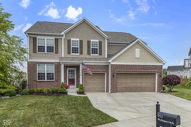 952 Workington Cir, Westfield, IN 46074 - view of front of home with concrete driveway, a front lawn, and brick siding