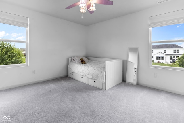952 Workington Cir, Westfield, IN 46074 - unfurnished bedroom with multiple windows, carpet flooring, and ceiling fan