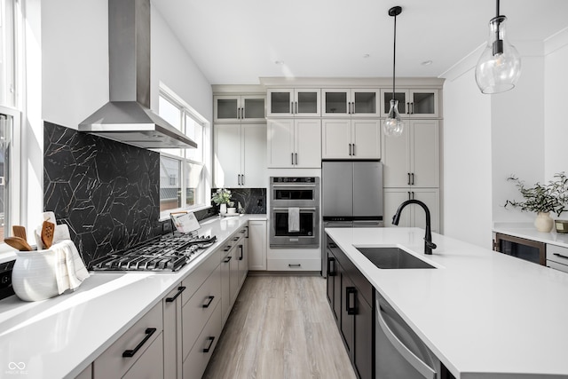 525 Fynn Pl, Indianapolis, IN 46202 - kitchen with a sink, wall chimney range hood, stainless steel appliances, and light countertops