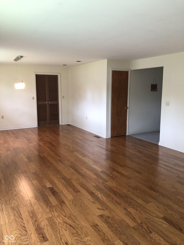 3619 31st St, Columbus, IN 47203 - empty room with dark wood finished floors and baseboards