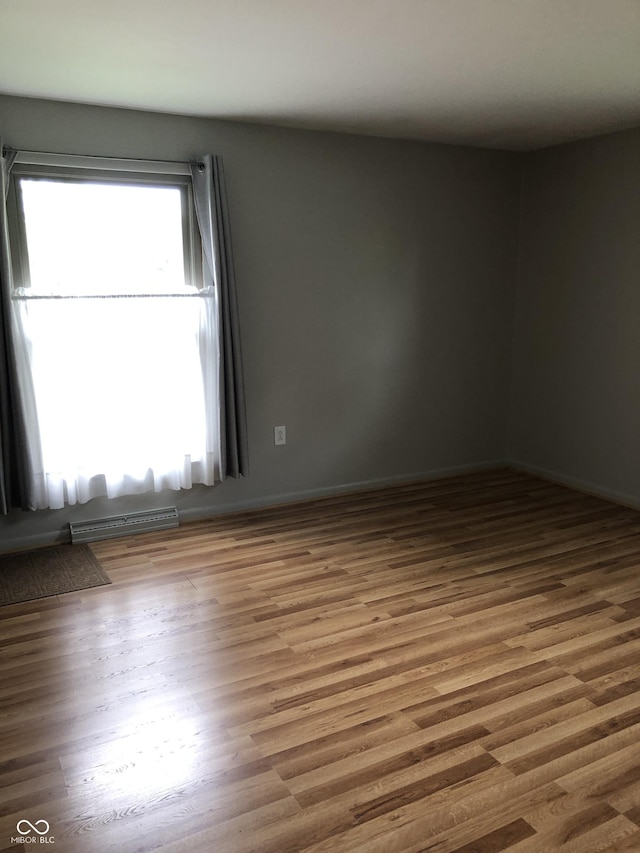 3619 31st St, Columbus, IN 47203 - spare room featuring wood finished floors and baseboards