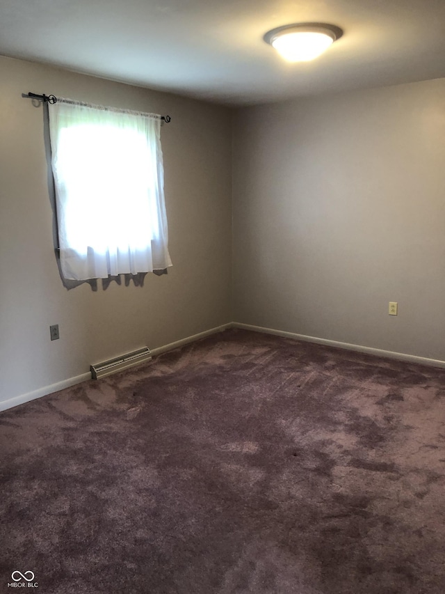 3619 31st St, Columbus, IN 47203 - spare room featuring dark colored carpet and baseboards